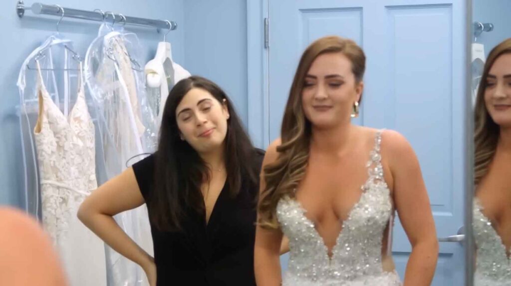 Bride crying happy tears in her highly discounted designer wedding dress.