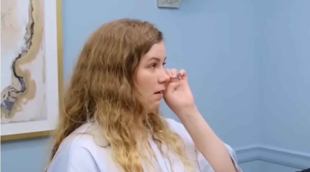 Non-traditional bride crying and experiencing an emotional breakdown due to an identity crisis in the fitting room