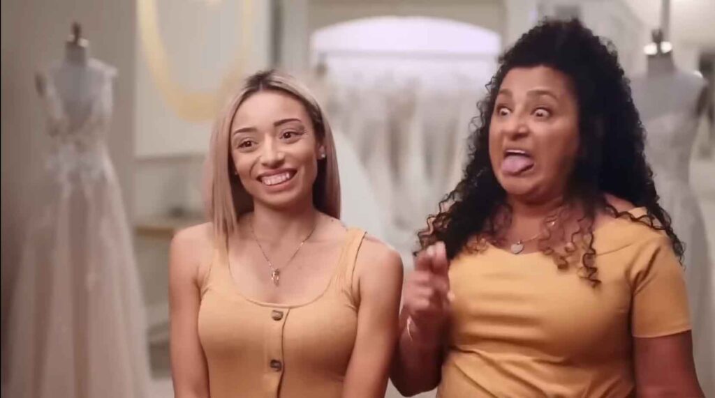 Exhausted sister complaining during a long bridal fitting appointment